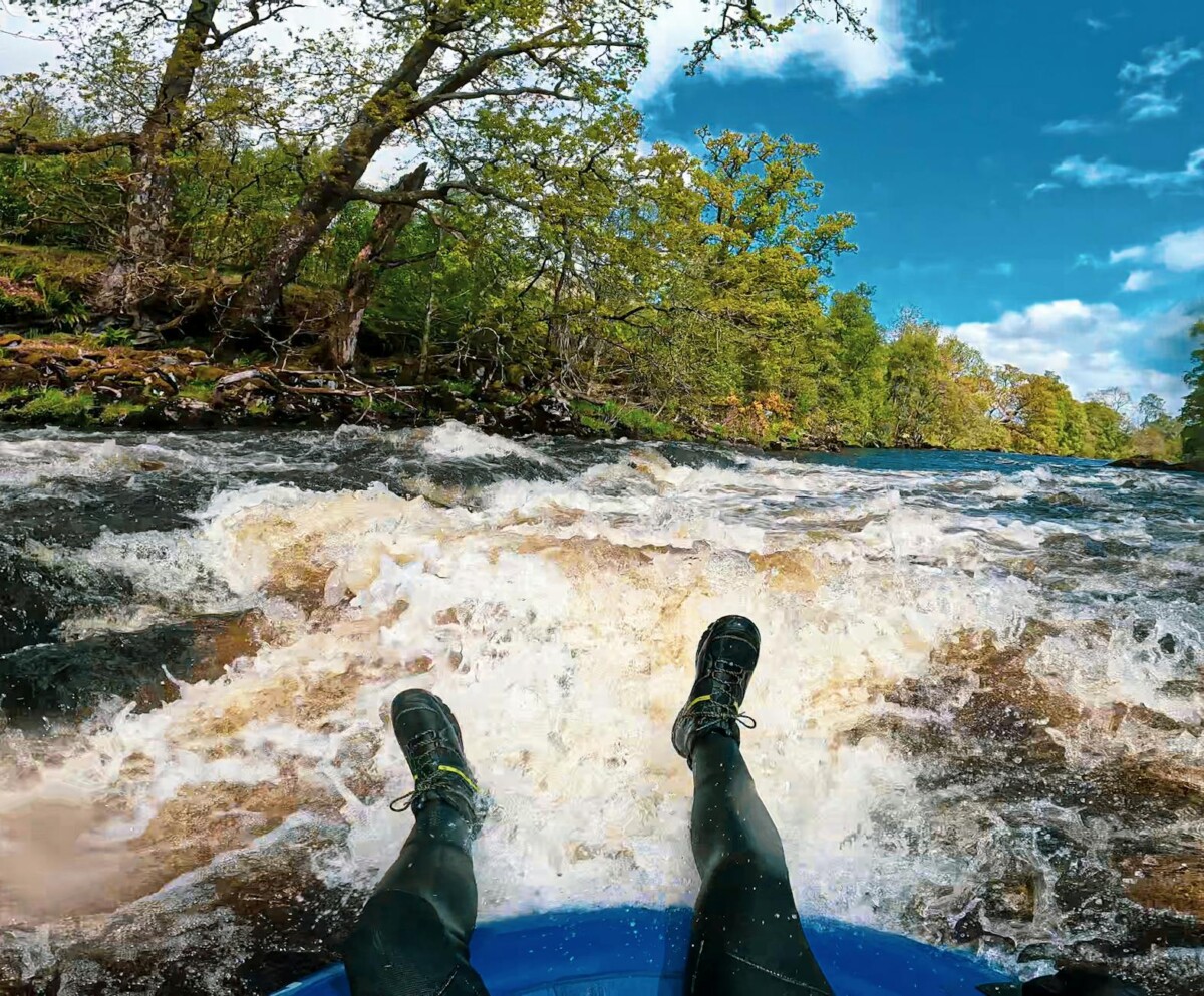 person riding rapids