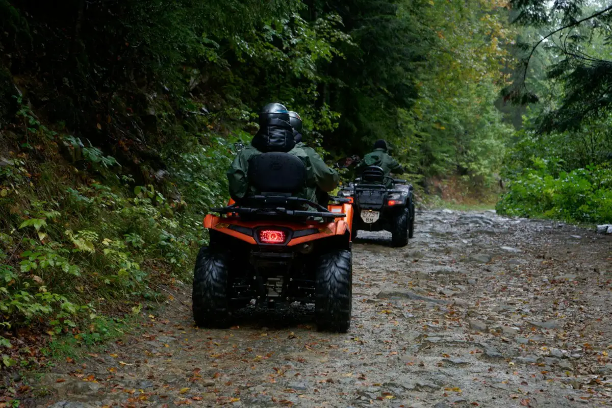 people driving quads